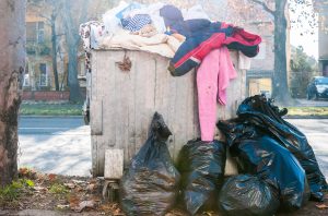 Bags of clothes in trash 