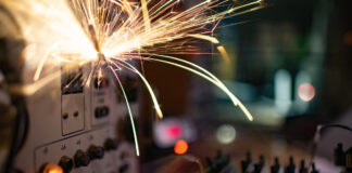 How FR Clothing Reduces Arc Flash Harm Flash fire on an electrical panel