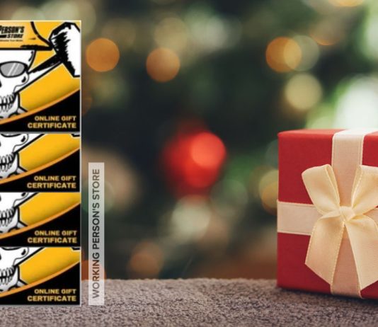 Working Person's Store gift cards stacked in order from $10 to $100 with a blurred out christmas tree in the background a a red gift with tan ribbon in the foreground
